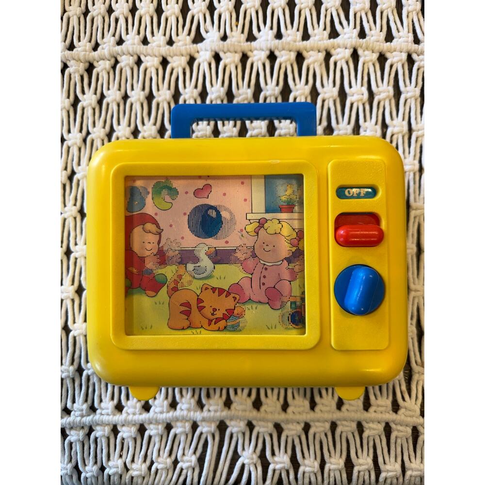 vintage 1990 yellow Shelcore musical wind-up TV